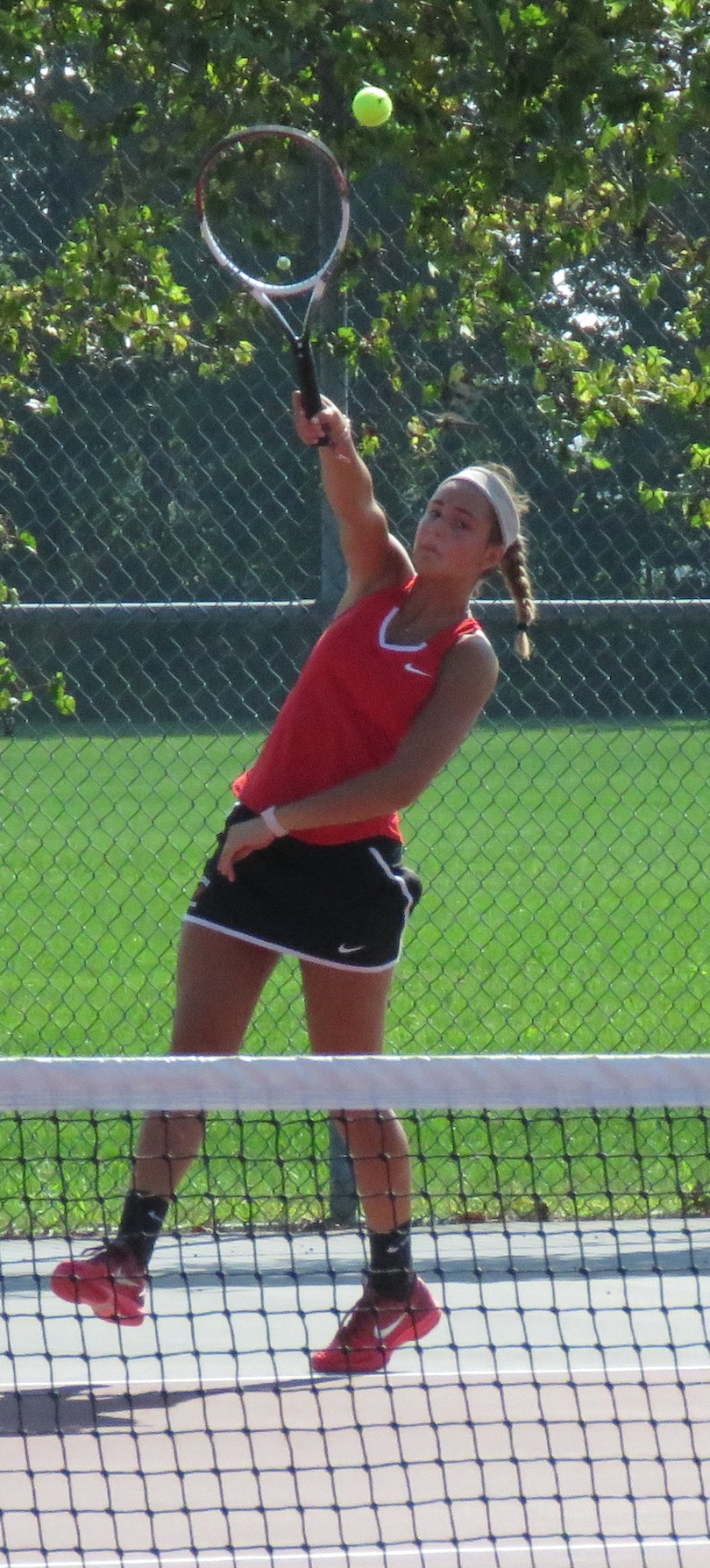 Jocelyn Fike serves during a match versus Grand Island earlier in the season. (Photo by David Yarger)